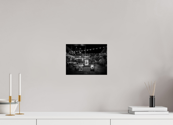 Stunning black and white capture of San Francisco Nights – Ghirardelli Square, illuminated by glowing strings of lights.