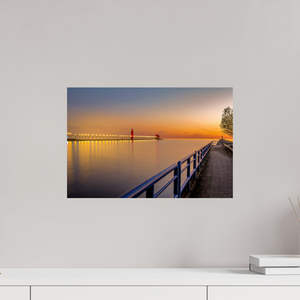 Serene sunset view of the Grand Haven channel, featuring "Calm on the Channel" artwork. Perfect for home decor.