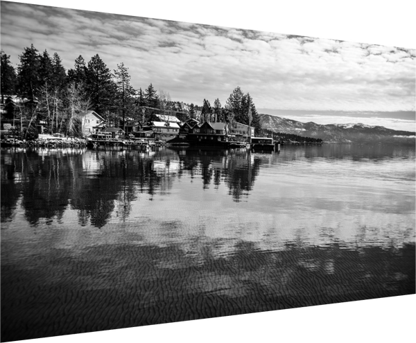 Serenity on the Water – Lake Tahoe in Black and White showcases tranquil lakeside reflections and stunning pines.