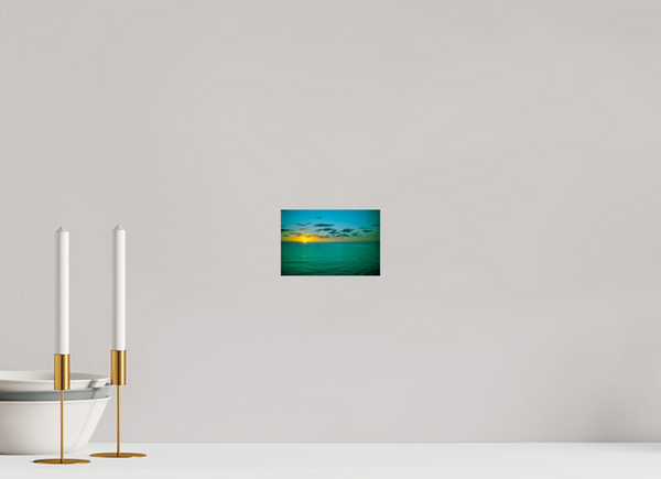 A Caribbean Sunset painting captures the vibrant hues of a stunning Caribbean sunset over calm waters.