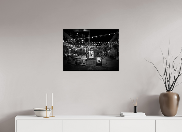 Enchanting black and white scene of San Francisco Nights – Ghirardelli Square, featuring glowing string lights.