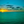 A Caribbean Sunset showcases vibrant colors as the sun sets over tranquil waters, creating a serene atmosphere.