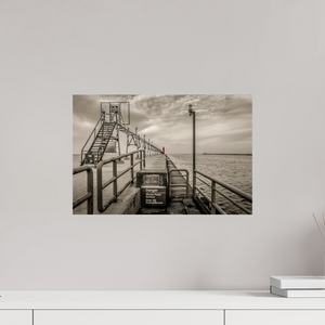 Big Red on the Grand Haven Pier showcases a striking lighthouse in vibrant red against a moody black-and-white backdrop.