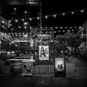 Stunning black and white scene of San Francisco Nights – Ghirardelli Square, showcasing vibrant lights and ambiance.