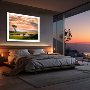 Stunning view of the Pebble Beach 17-mile Road, featuring vibrant greens and coastal beauty at sunset.