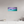 Boats moored in a Caribbean harbor showcase the serene Aftermath in the Harbor scene. Perfect for coastal decor.