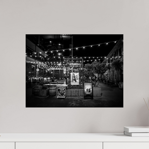 Enchanting San Francisco Nights – Ghirardelli Square, illuminated by glowing strings of lights in a stunning black and white scene.