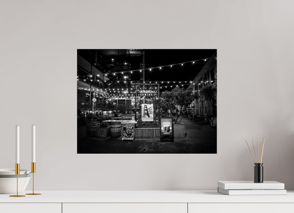 Enchanting San Francisco Nights – Ghirardelli Square, illuminated by glowing strings of lights in a stunning black and white scene.