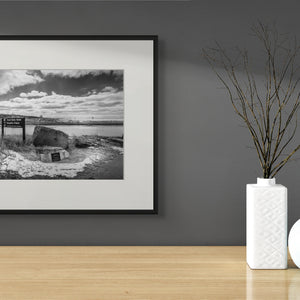Striking black-and-white photo capturing the Grand Haven Harbor Navigation Project's rugged lakeshore beauty.