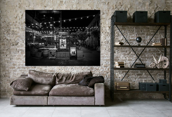 Stunning black and white view of San Francisco Nights – Ghirardelli Square, featuring glowing ambiance and historic charm.